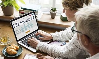 Two people looking up life insurance