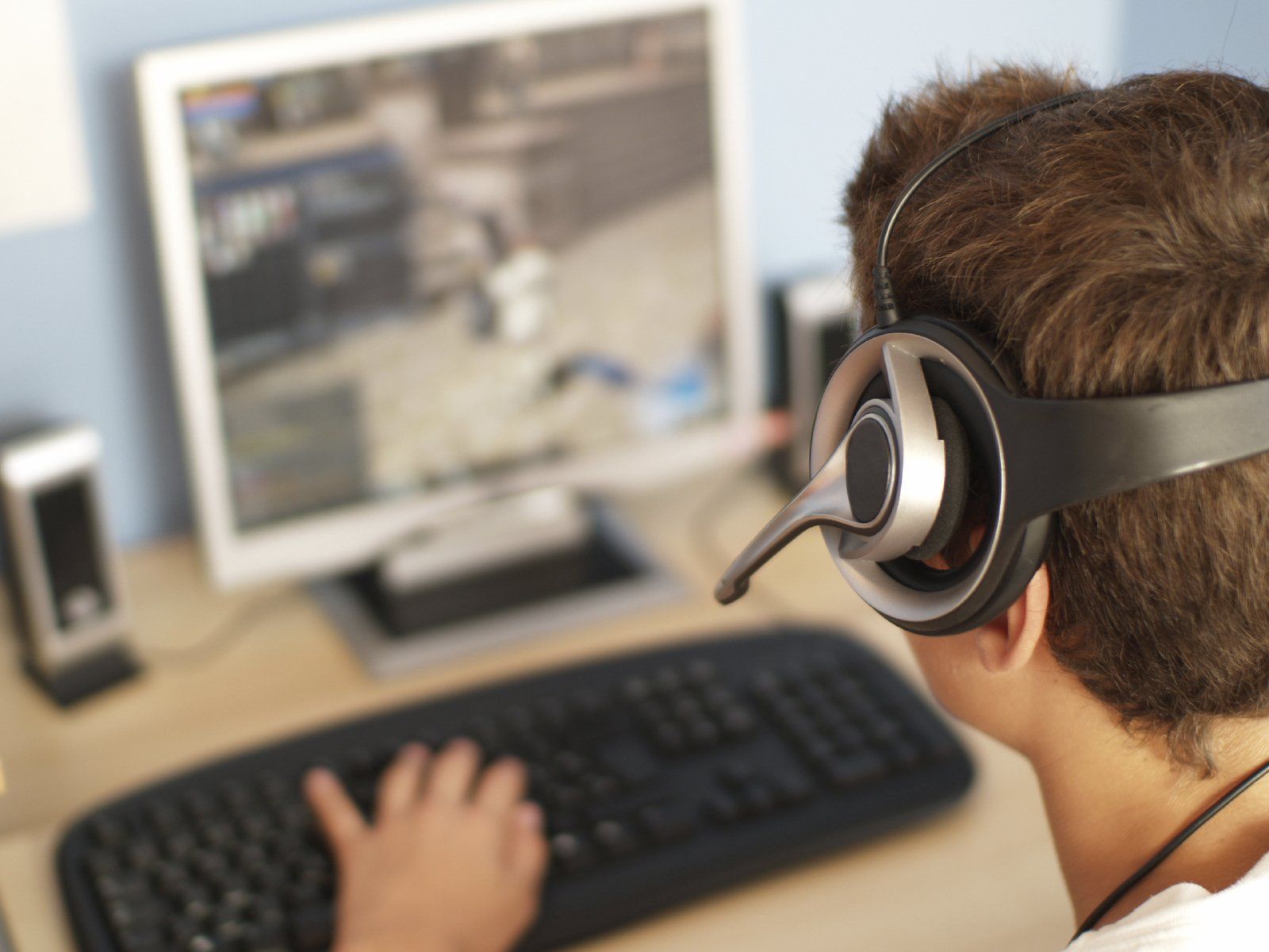 man using headset with computer