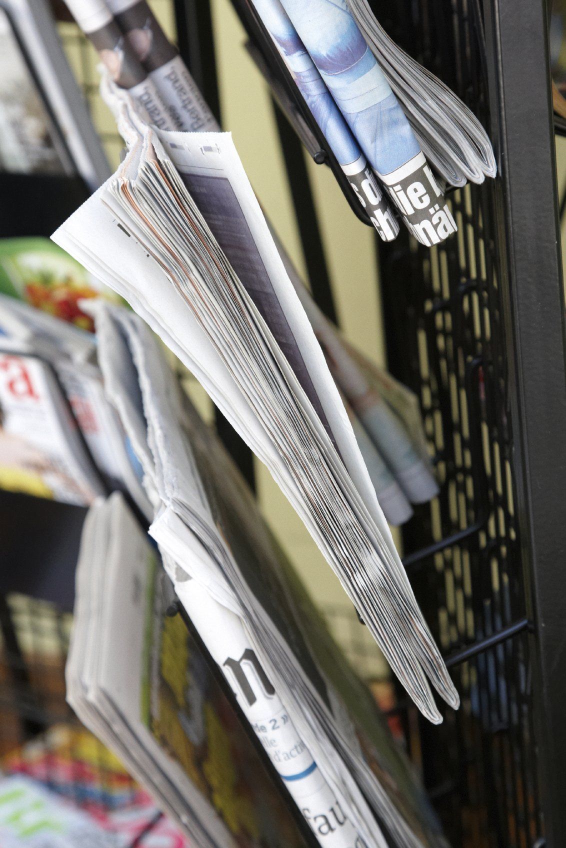 Newspapers in rack