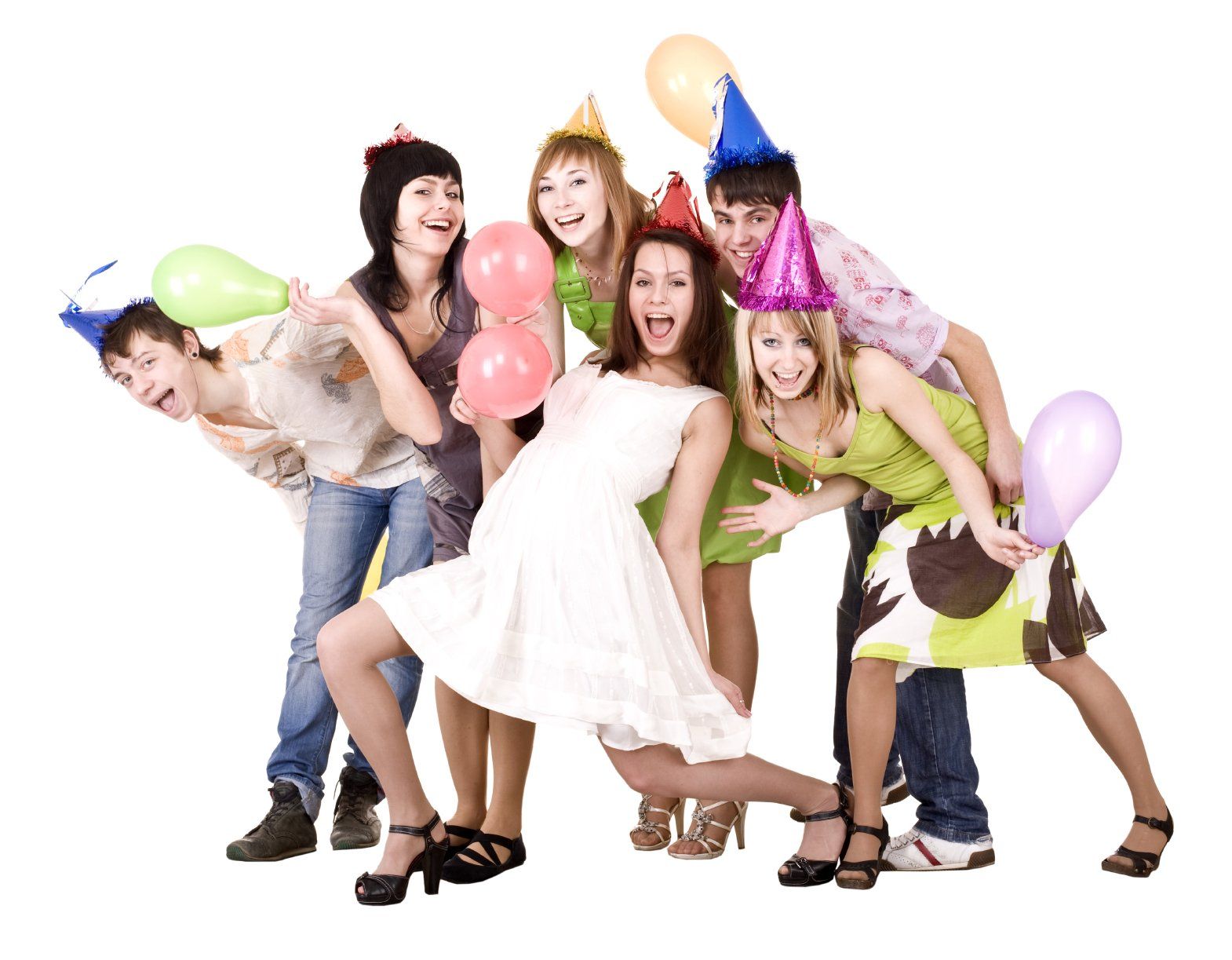 Six young people with party hats having a good laugh