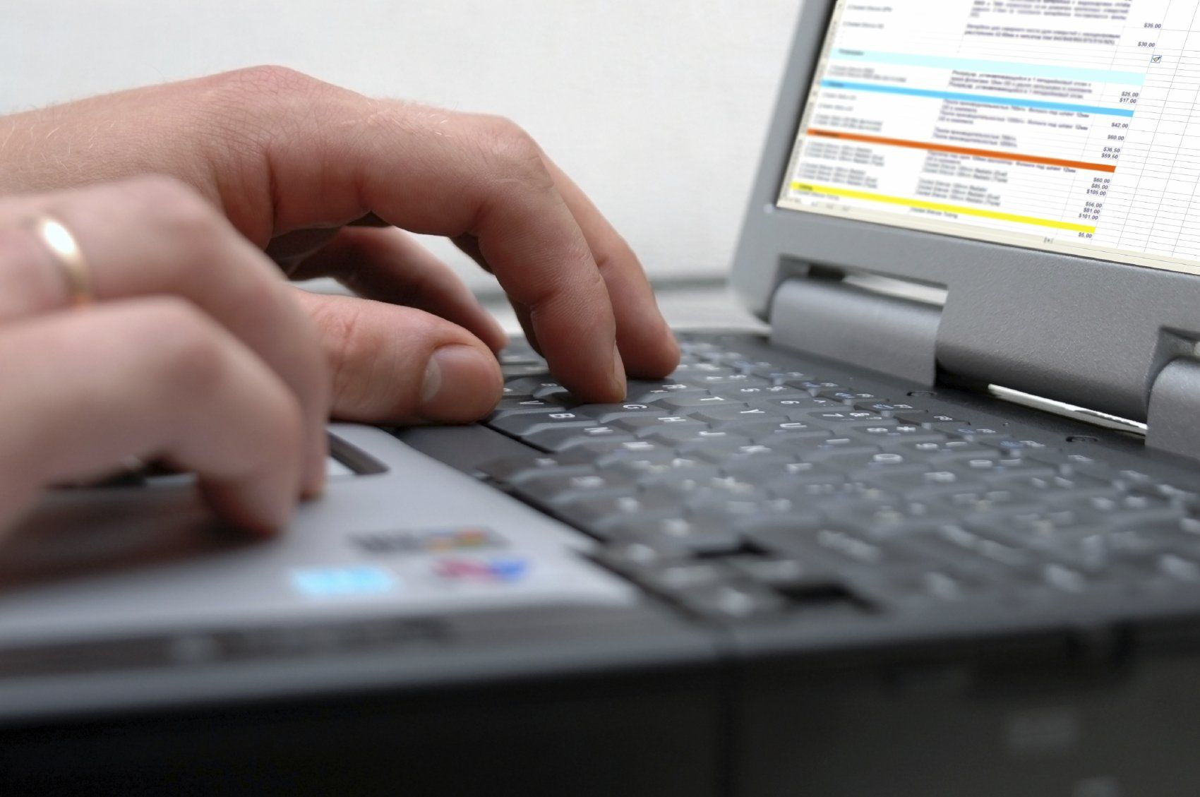 The hands of a student on a laptop