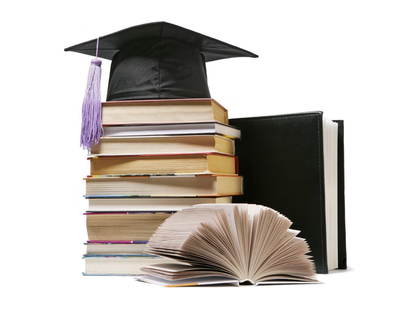 A graduation cap sitting on a bundle of test books.