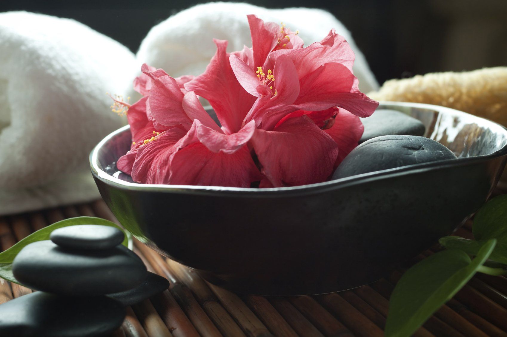 pink flower in a grey bowl