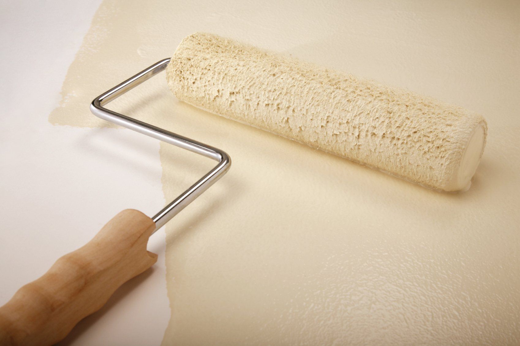 paint roller with cream paint