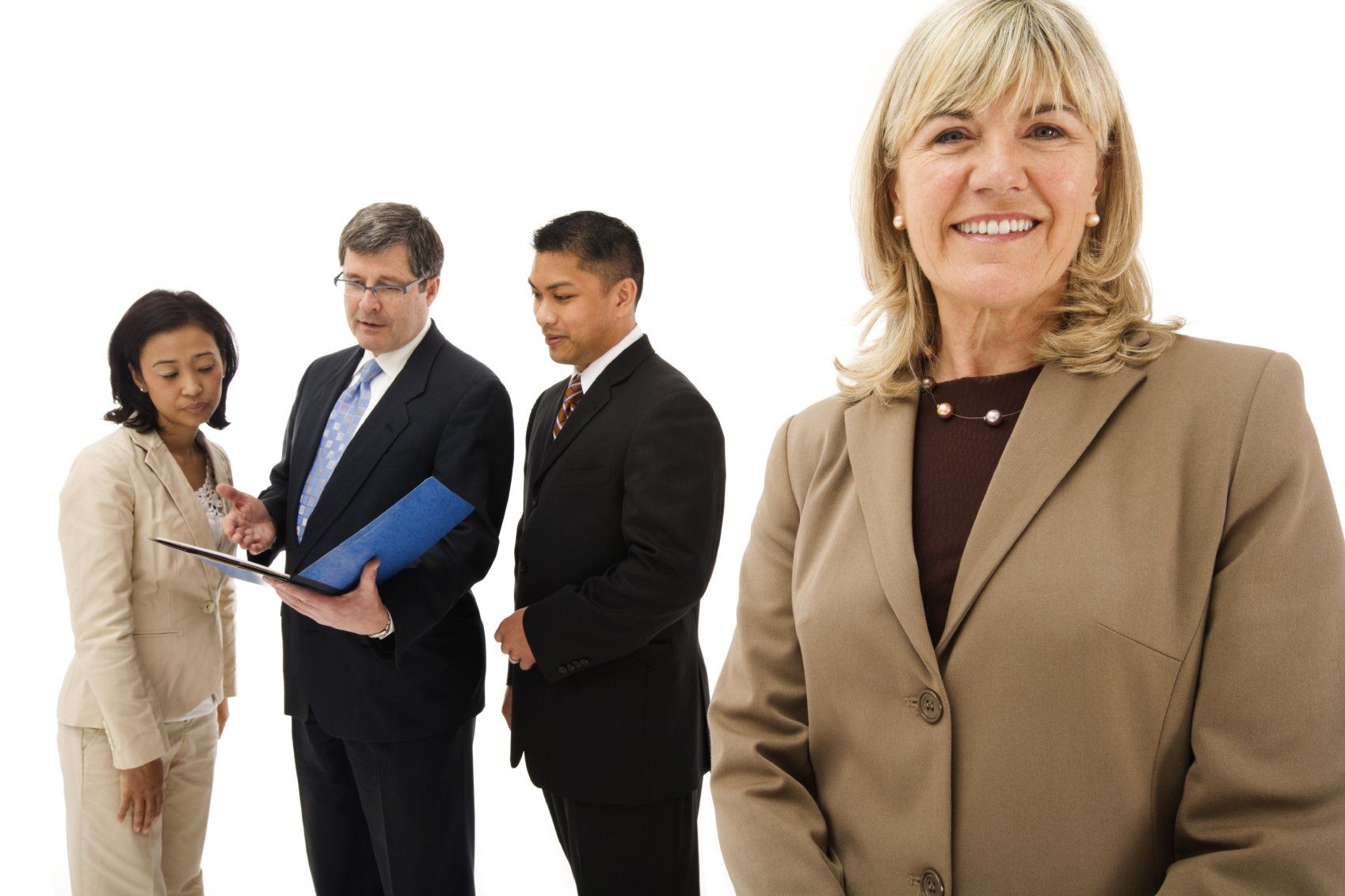 Two businessmen and two businesswomen preparing  for ameeting.