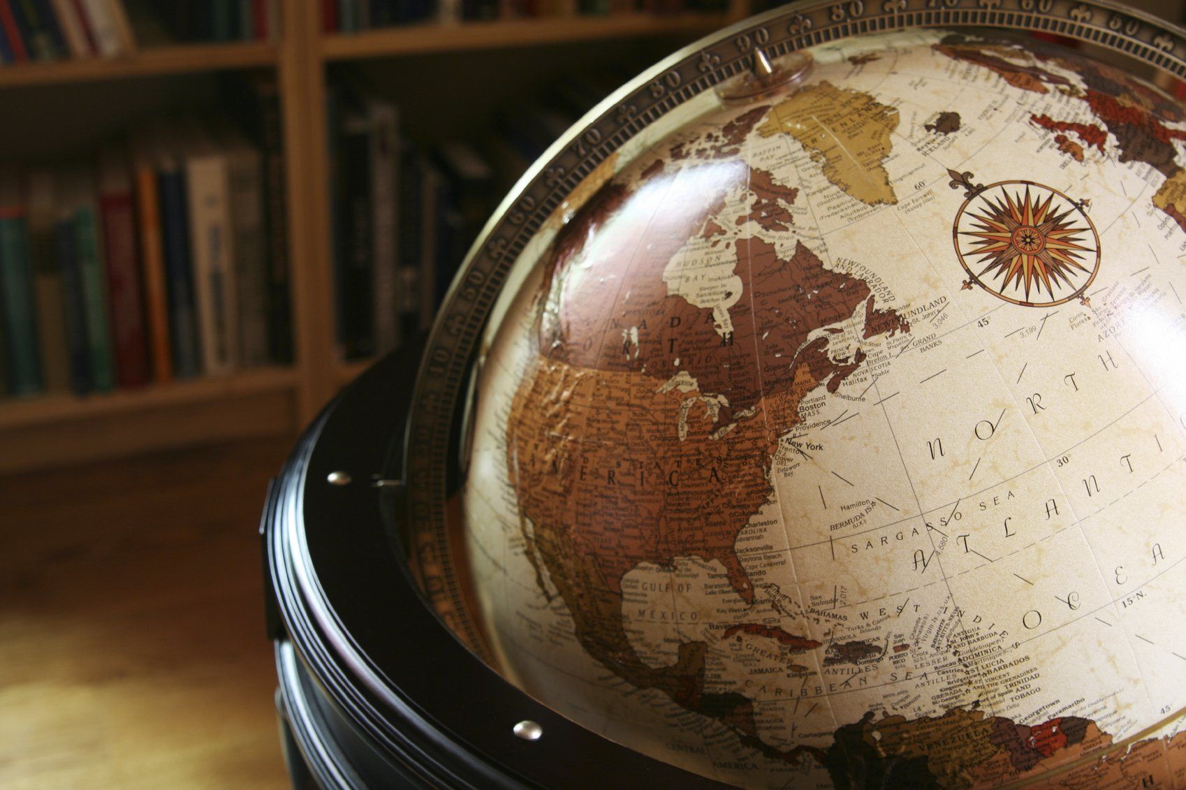 A globe of the world sitting on a pedestal