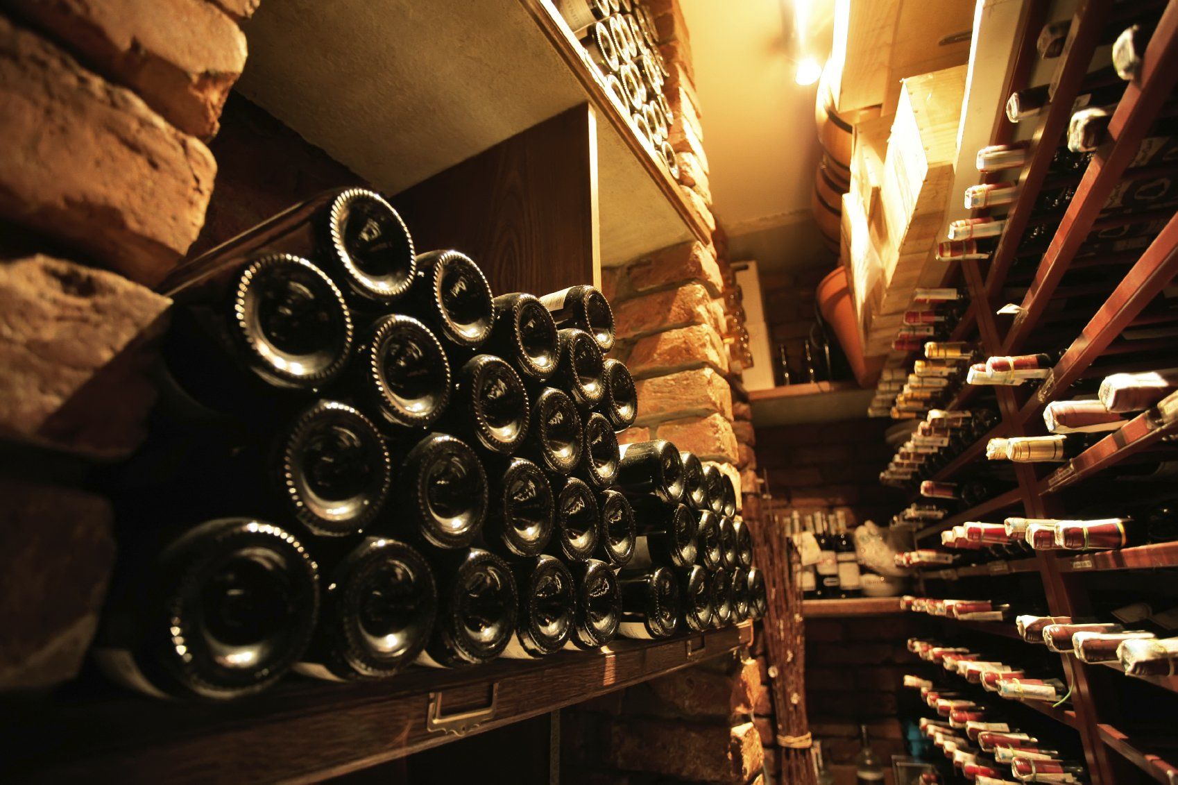 A large number of bottles of French wine in a cellar