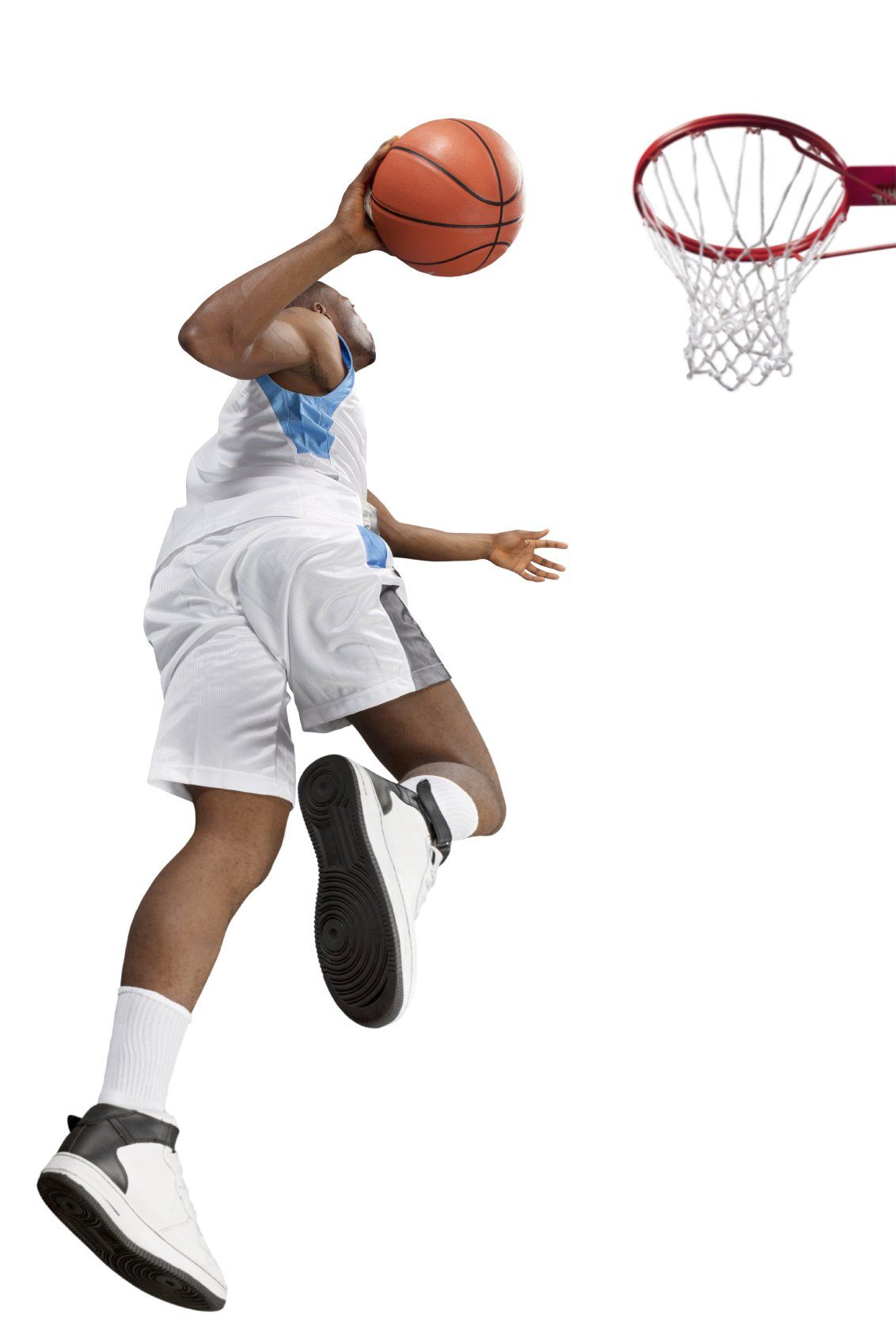 Young basketball player going up to score a point