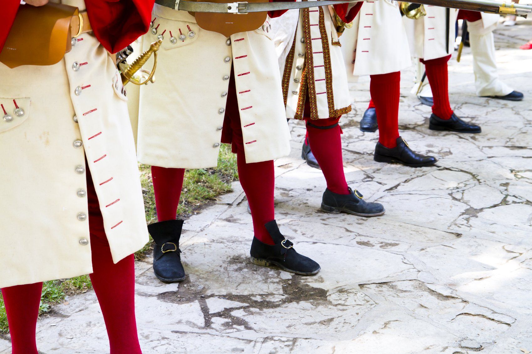 Legs of uniformed Spanish soldiers.