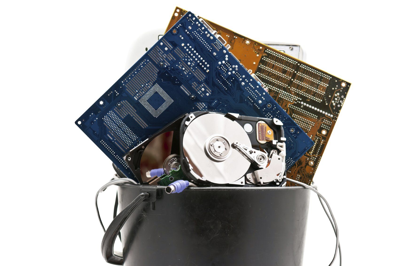 A bucket containing discarded electronic appliances.