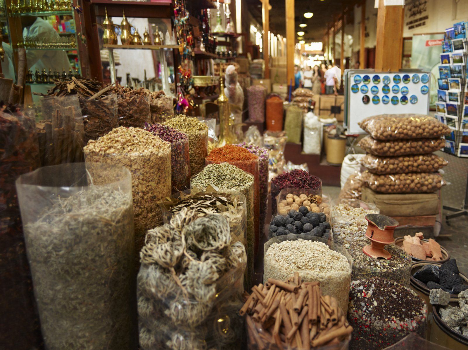  Various spices and goods highlighting developments in German-Italian law are on display at a covered market stall