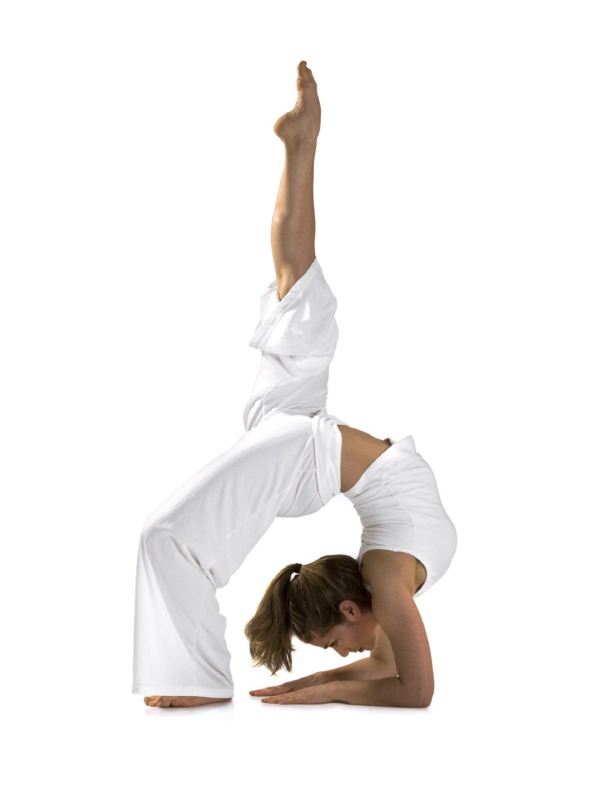 Woman in white outfit performing Yoga acrobatics