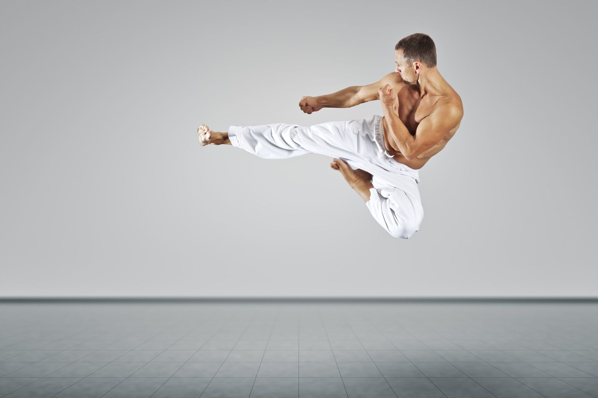 Man kicking in a martial arts style