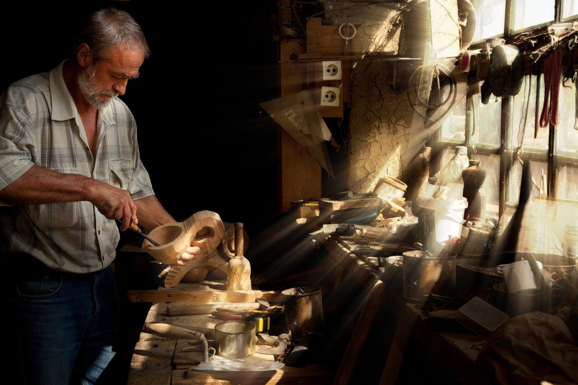 A woodworker carving a piece of wood