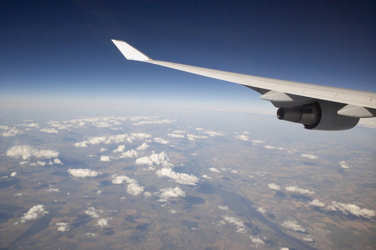 aeroplane wing over earth