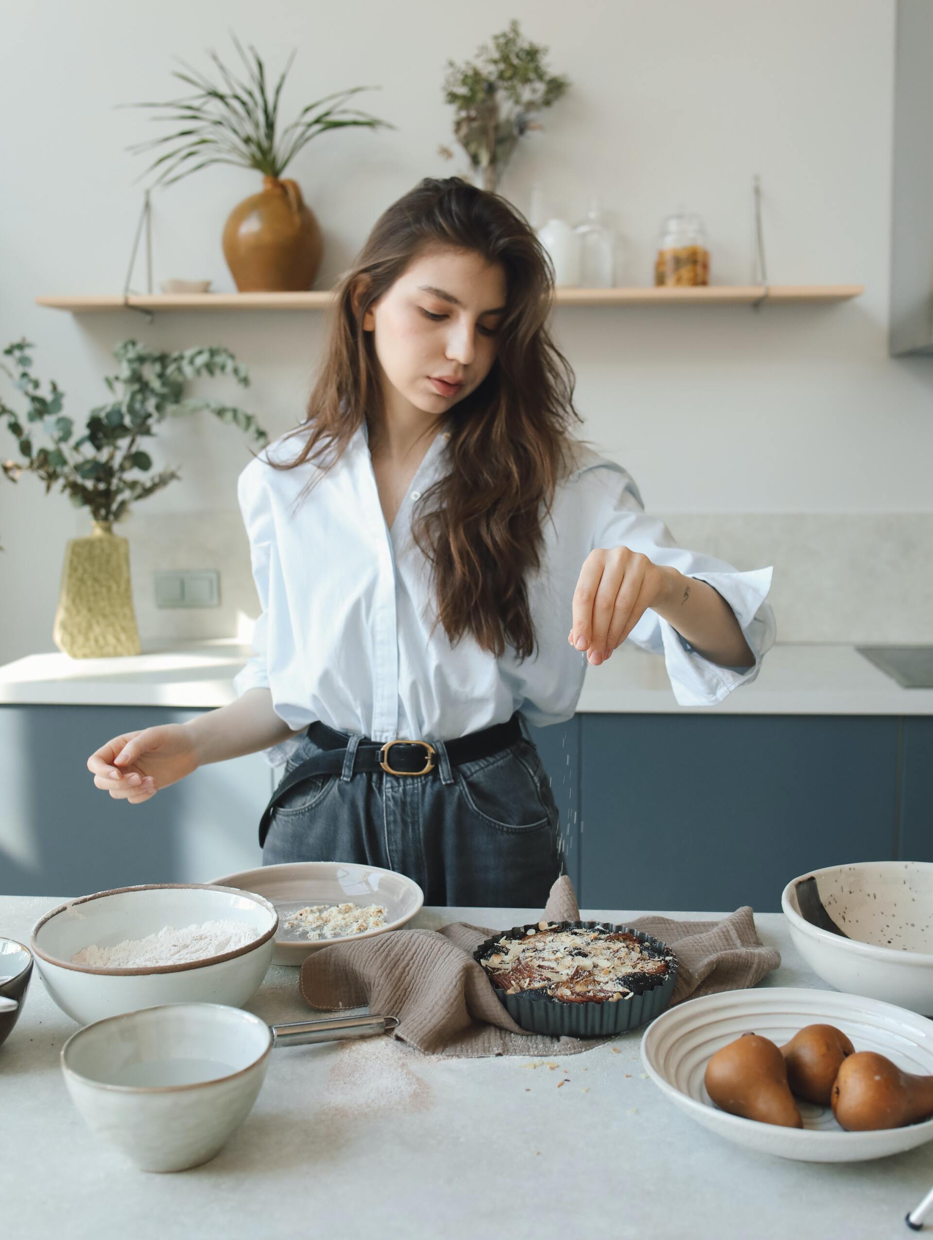 Woman in kitchen preparing a recipe