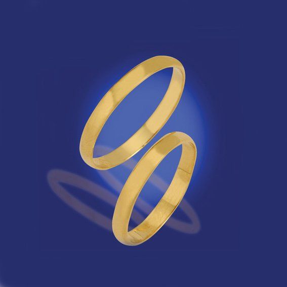 Zwei zusammengehörige schmale Eheringe in Gelbgold, minimalistisch.