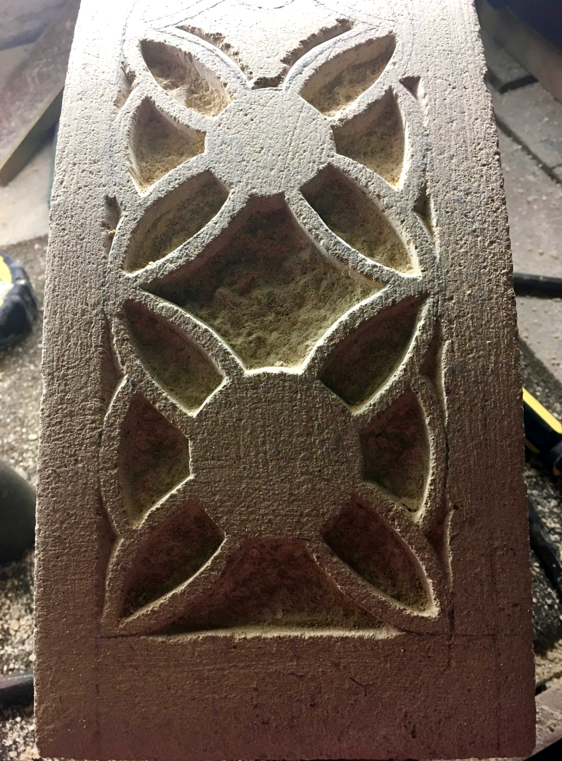 Stained glass design translated into the stone