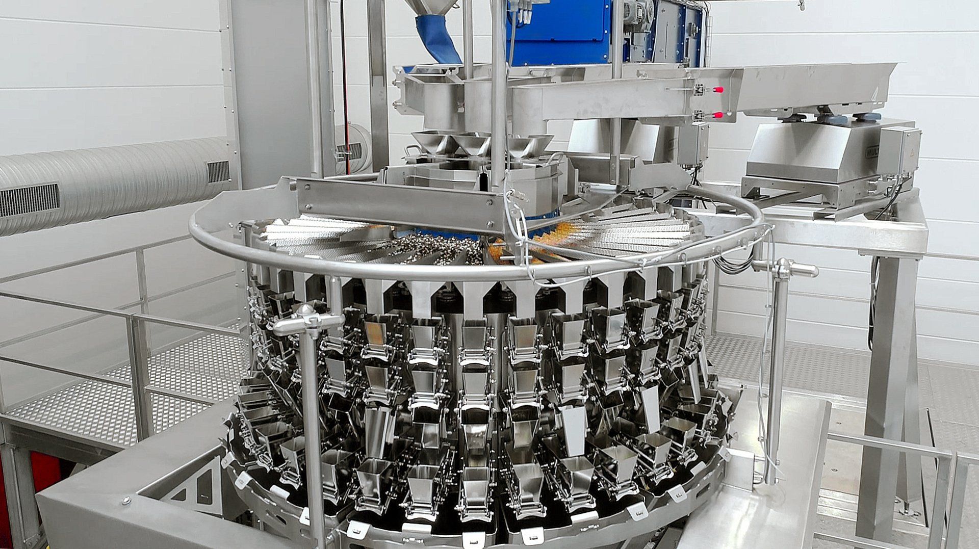 Multi-head weigher on a Grunwald Rotary filling and sealing machine