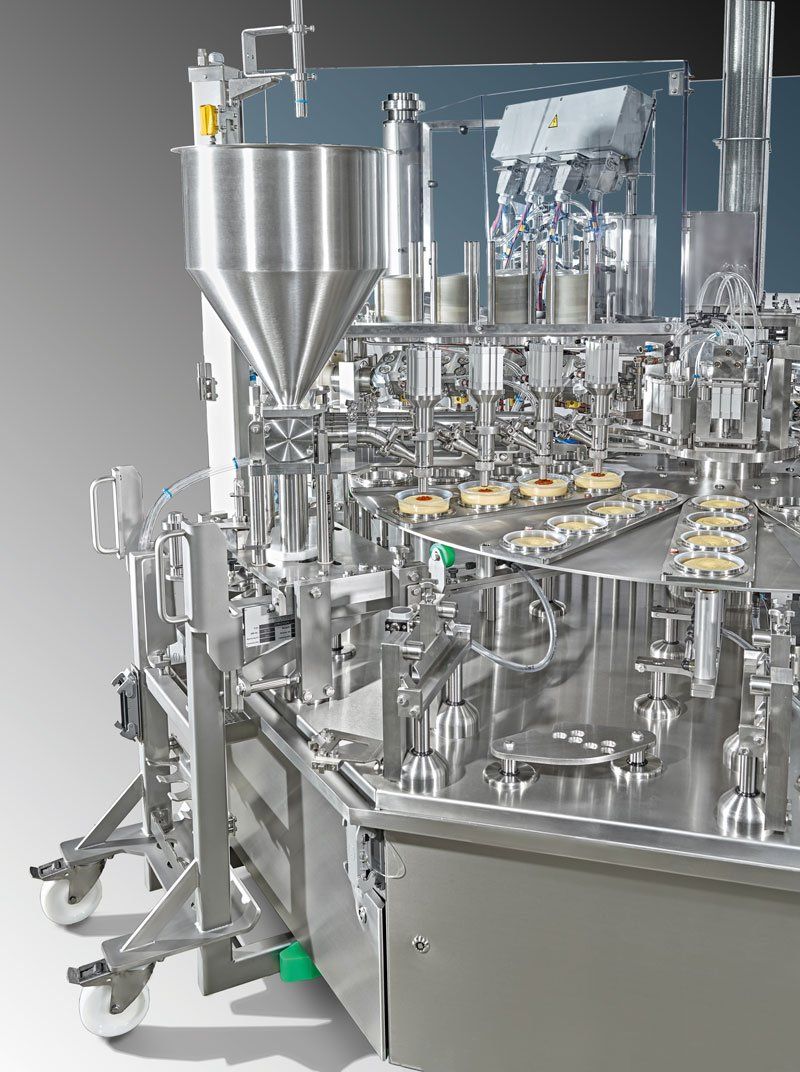 up to 10k pots per hour Rotary 4 lane hummus filling and decor