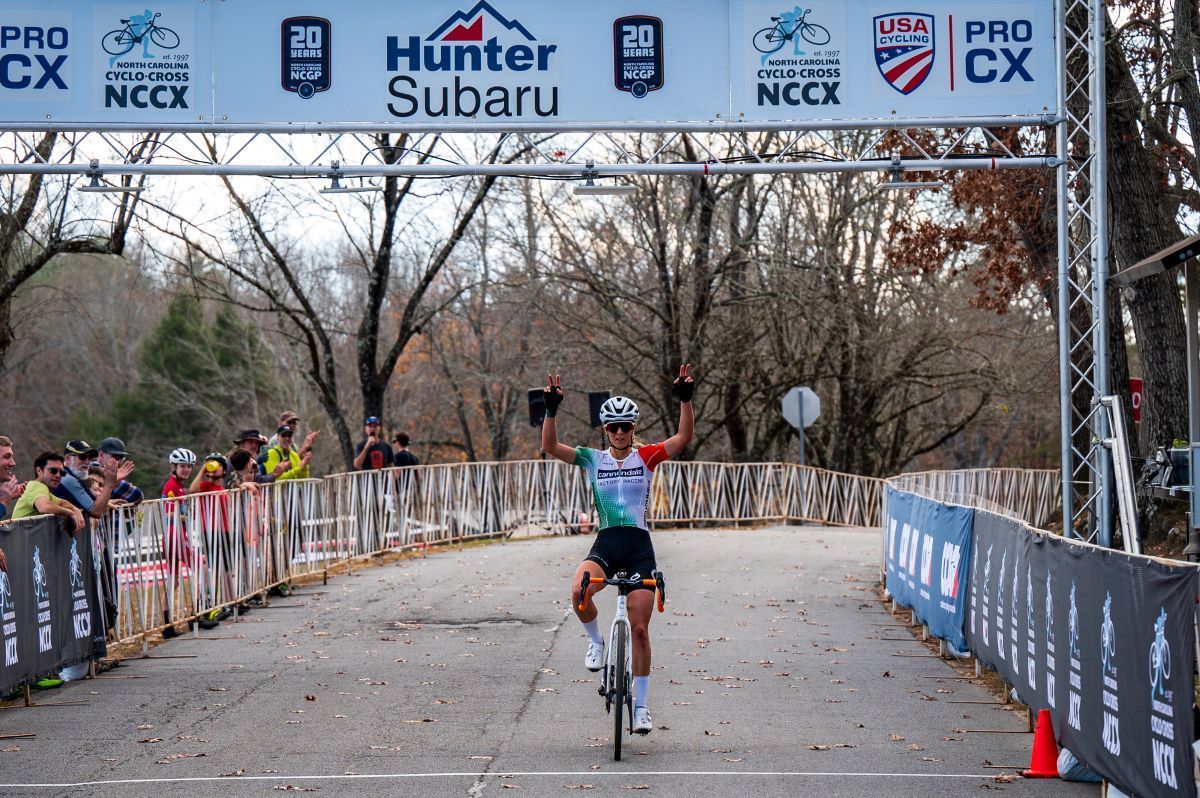 A female cyclists crosses the finishline. Photo by Jamie Arkfeld Photography. Used by permission.