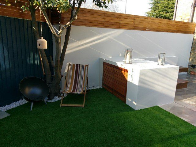 aftificial grass lawn new storage with hardwood doors rendered wall paint white little hardewood sceen london design back garden
