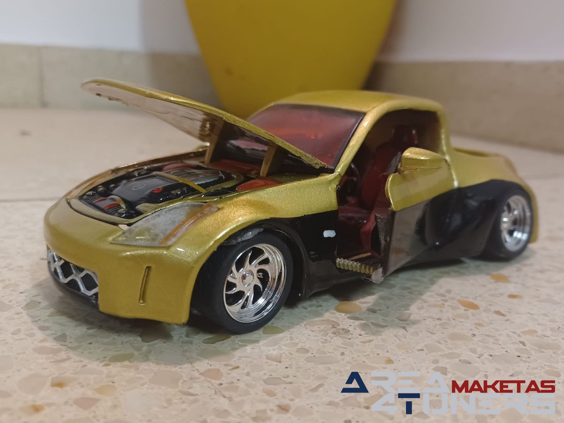 Reportaje maqueta coche Tuning Nissan 350z Explicit Pickup Imagen perteneciente al reportaje de la revista Area4tuners.es sobre una maqueta de coche Tuning 1:24 Nissan 350z Explicit Pickup