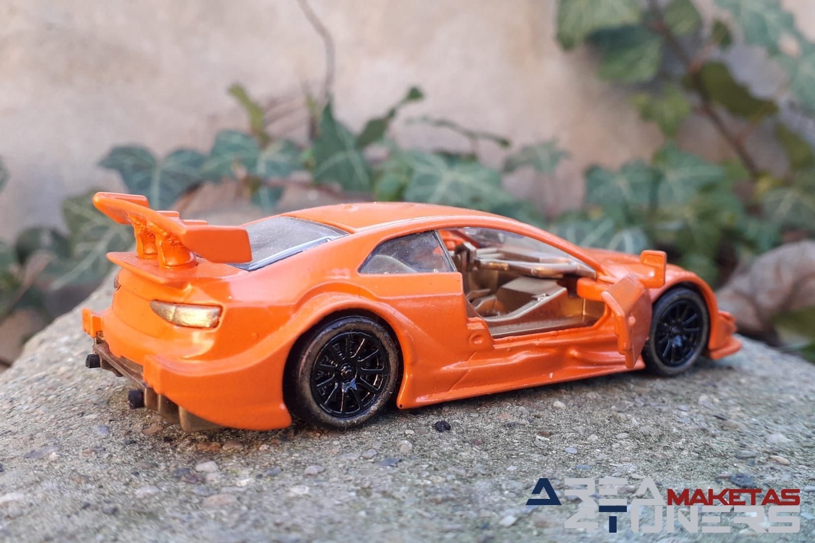 Reportaje maqueta Tuning Audi Rs5 Clockwork Orange Imagen perteneciente al reportaje fotográfico de la revista Tuning de publicación diaria Area4tuners.es sobre una maqueta Tuning 1:44 Audi Rs5