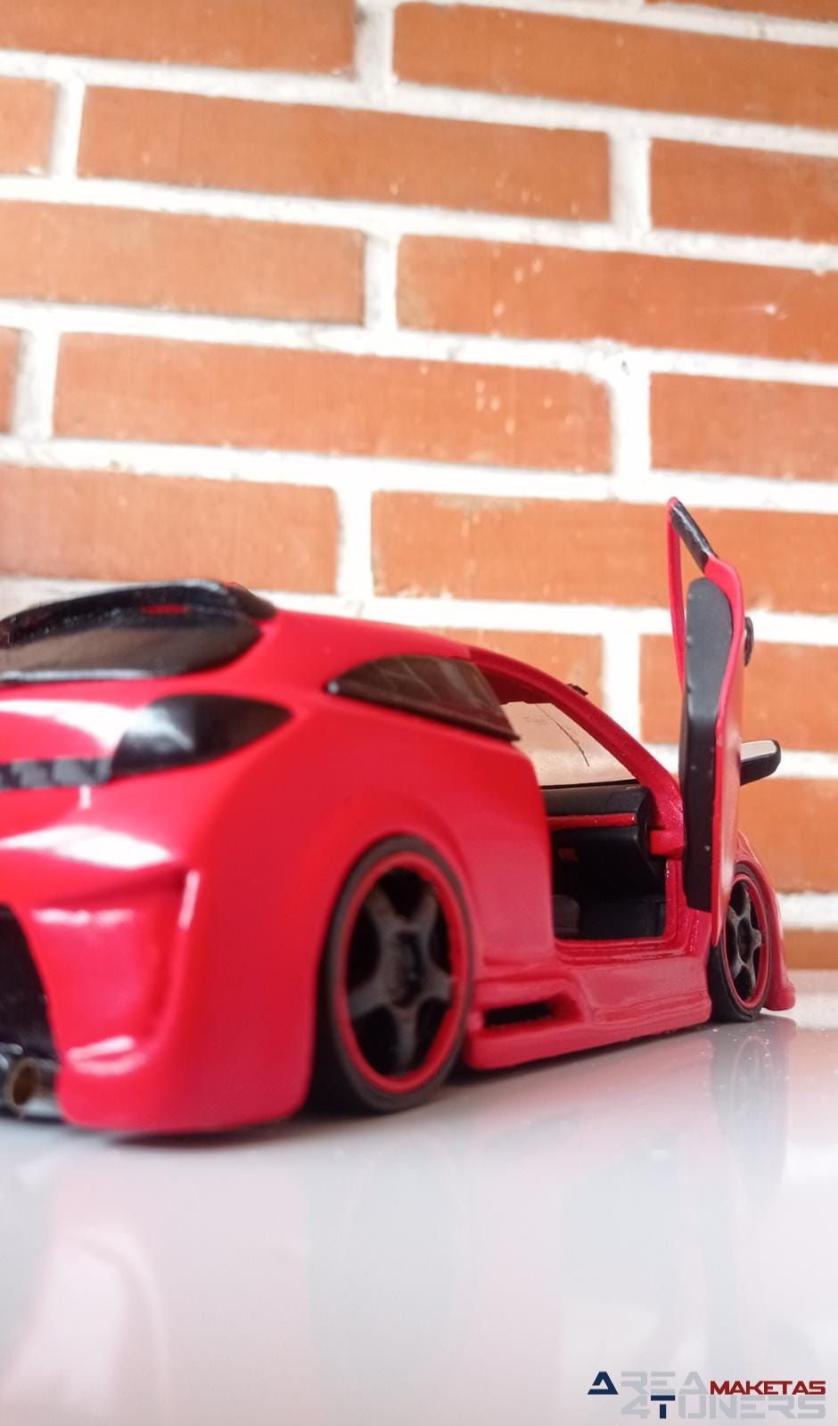 Reportaje maqueta Tuning Opel Astra Astru Imagen perteneciente al reportaje fotográfico de la revista Tuning de publicación diaria Area4tuners.es sobre una maqueta Tuning 1:24 Opel Astra