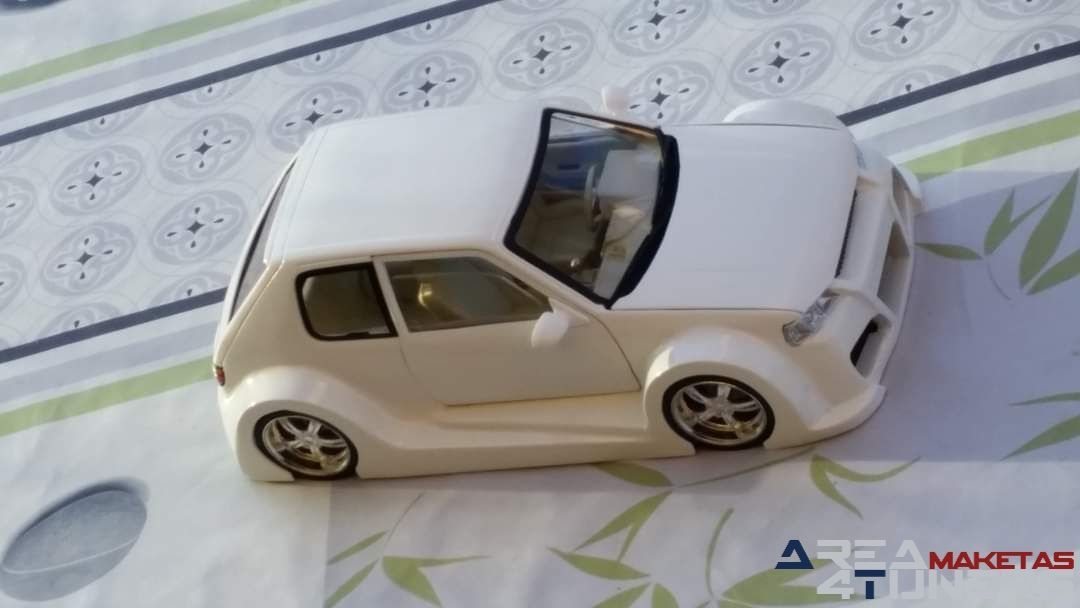 Reportaje maqueta coche Tuning Peugeot 205 Wow! Imagen perteneciente al reportaje de la revista Area4tuners.es sobre una maqueta de coche Tuning 1:18 Peugeot 205 Wow!