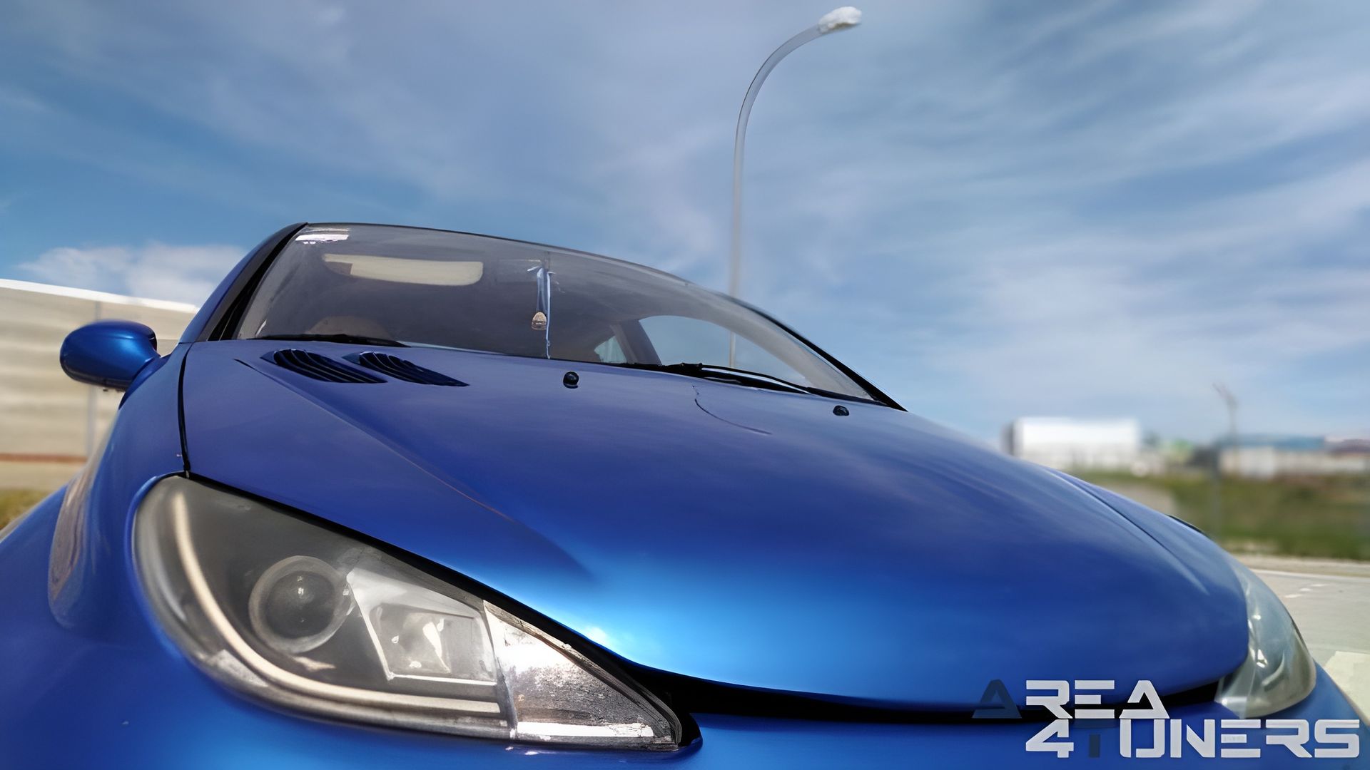 Imagen reportaje coche Tuning Peugeot 206 La Canica Azul Imagen perteneciente al reportaje de coche Tuning, de la revista Area4tuners sobre un Peugeot 206