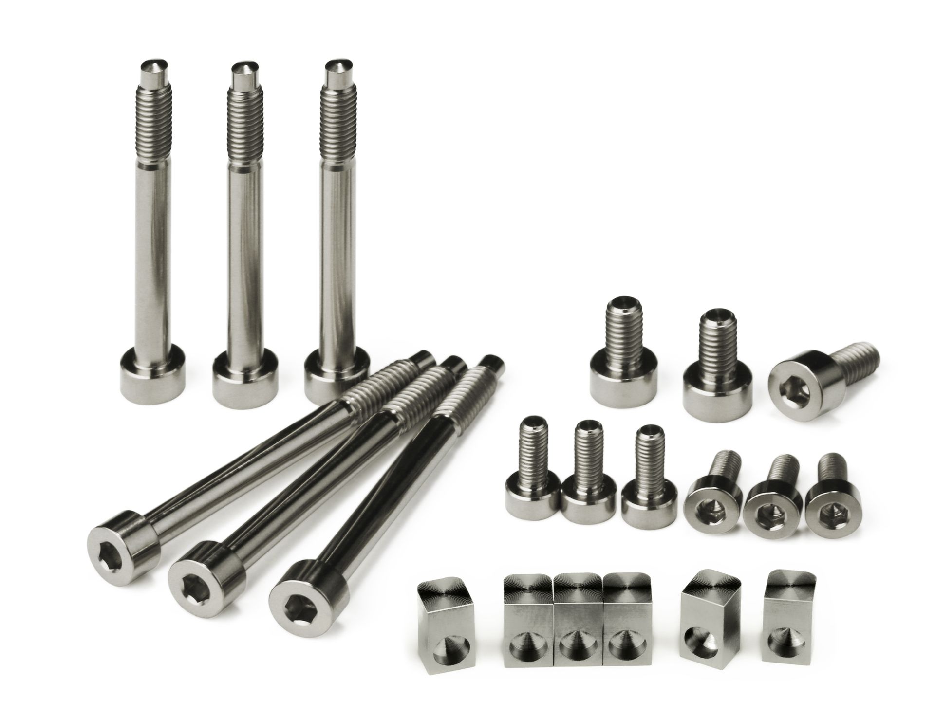 Professional, high-performance natural colored titanium upgrade set for a 6-string Floyd Rose, Schaller Lockmeister, or similar tremolo system. Includes 6 locking screws, 6 saddle mounting screws, 3 locking nut screws, and 6 string locking insert blocks, all arranged on a white background.