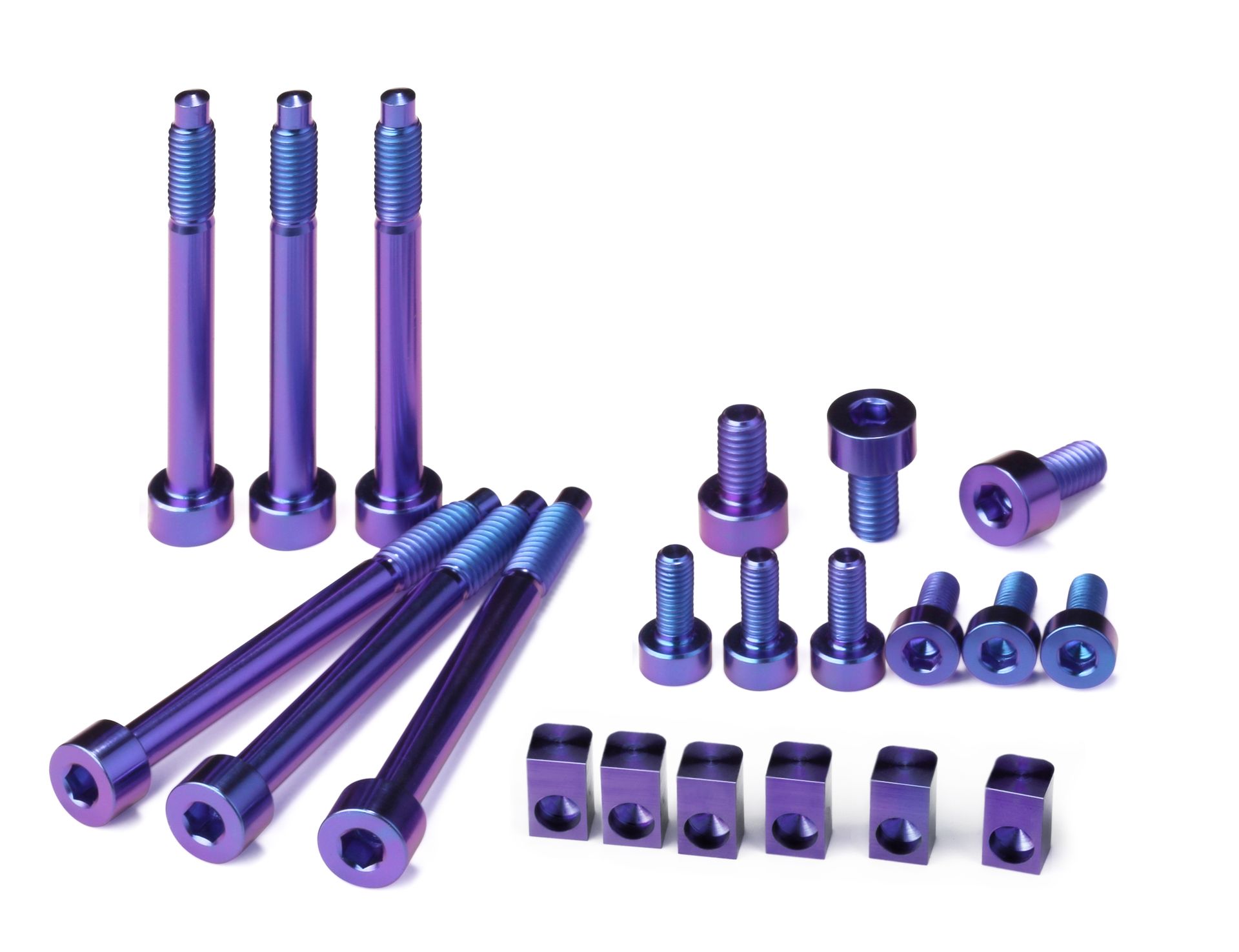 Professional, high-performance purple anodized titanium upgrade set for a 6-string Floyd Rose, Schaller Lockmeister, or similar tremolo system. Includes 6 locking screws, 6 saddle mounting screws, 3 locking nut screws, and 6 string locking insert blocks, all arranged on a white background.