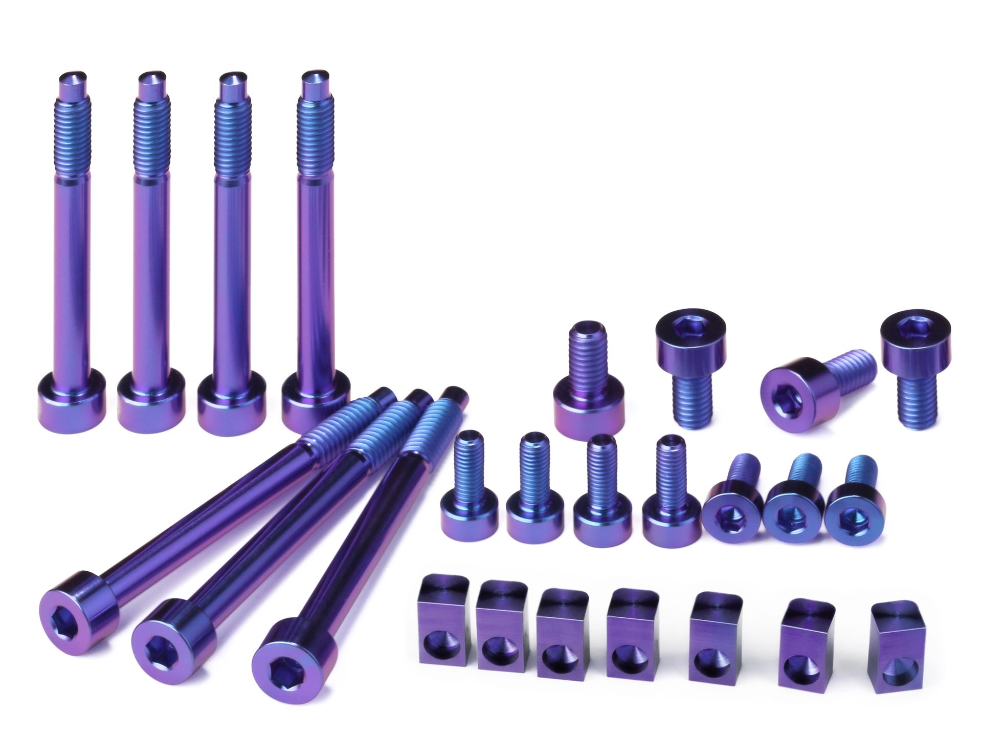 Professional, high-performance purple anodized titanium upgrade set for a 7-string Floyd Rose, Schaller Lockmeister, or similar tremolo system. Includes 7 locking screws, 7 saddle mounting screws, 4 locking nut screws, and 7 string locking insert blocks, all arranged on a white background.