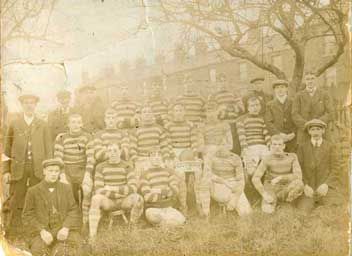 Black and white photo of army personnel in uniform before restoration