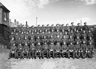 Restored black and white photo of army personnel in uniform
