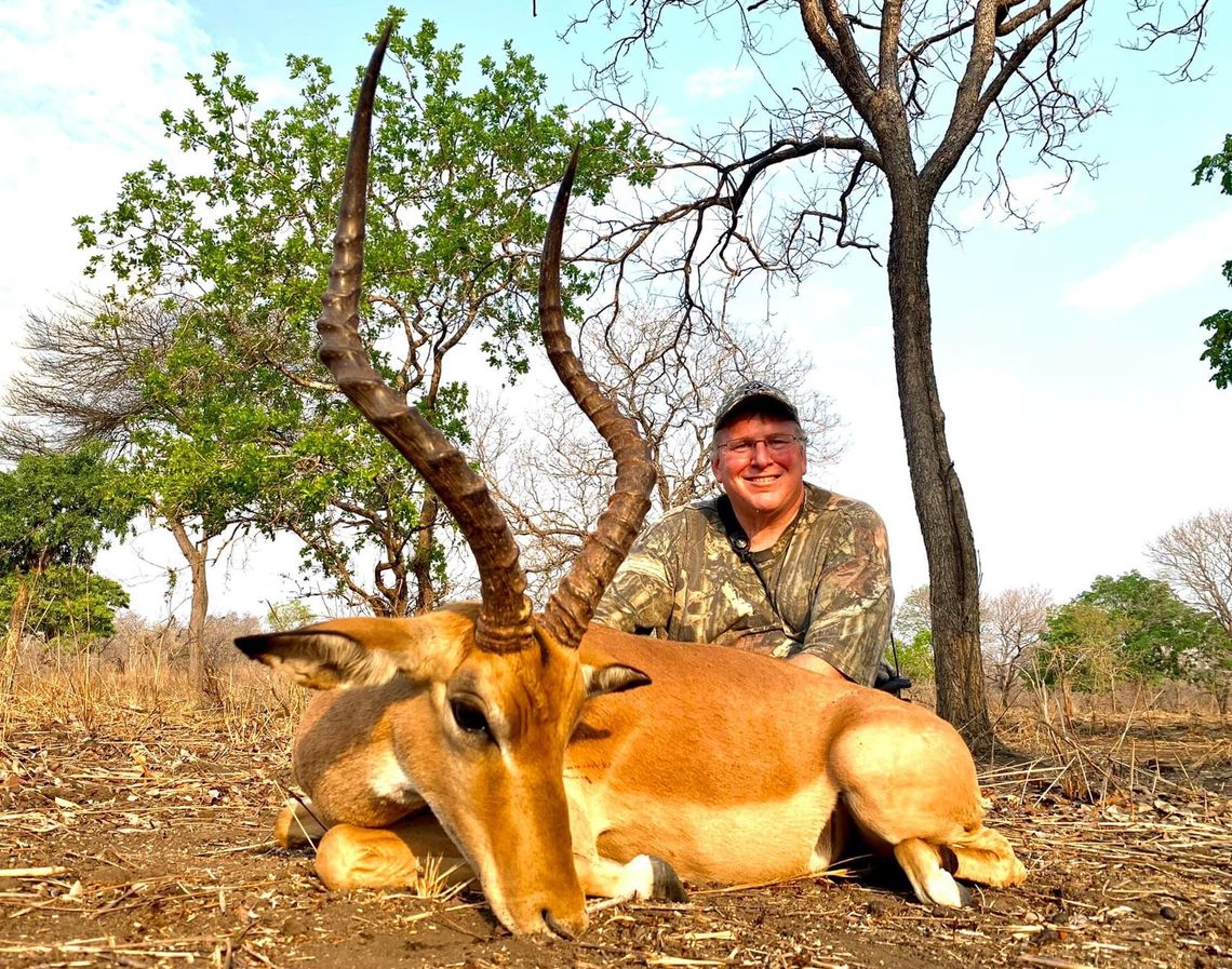 Picture of a hunter with an impala