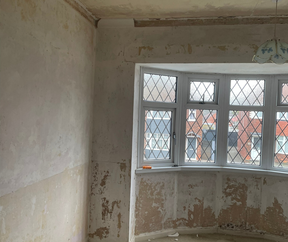 Living room in a domestic property being assessed during an asbestos survey to ensure safe living conditions