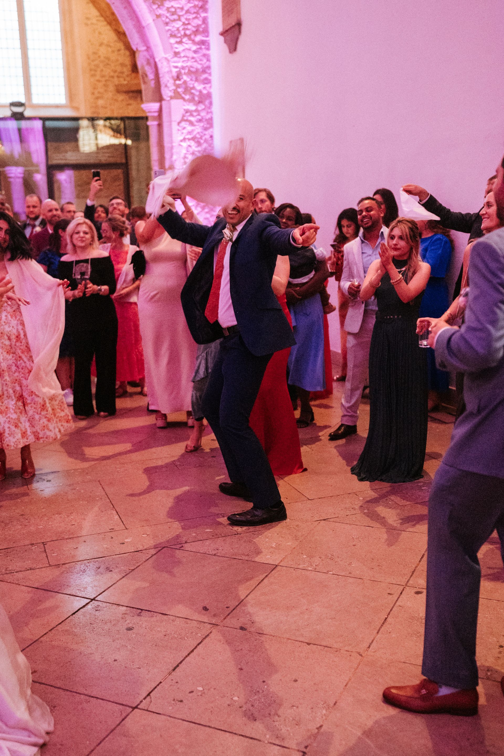 wedding guests dancing inside