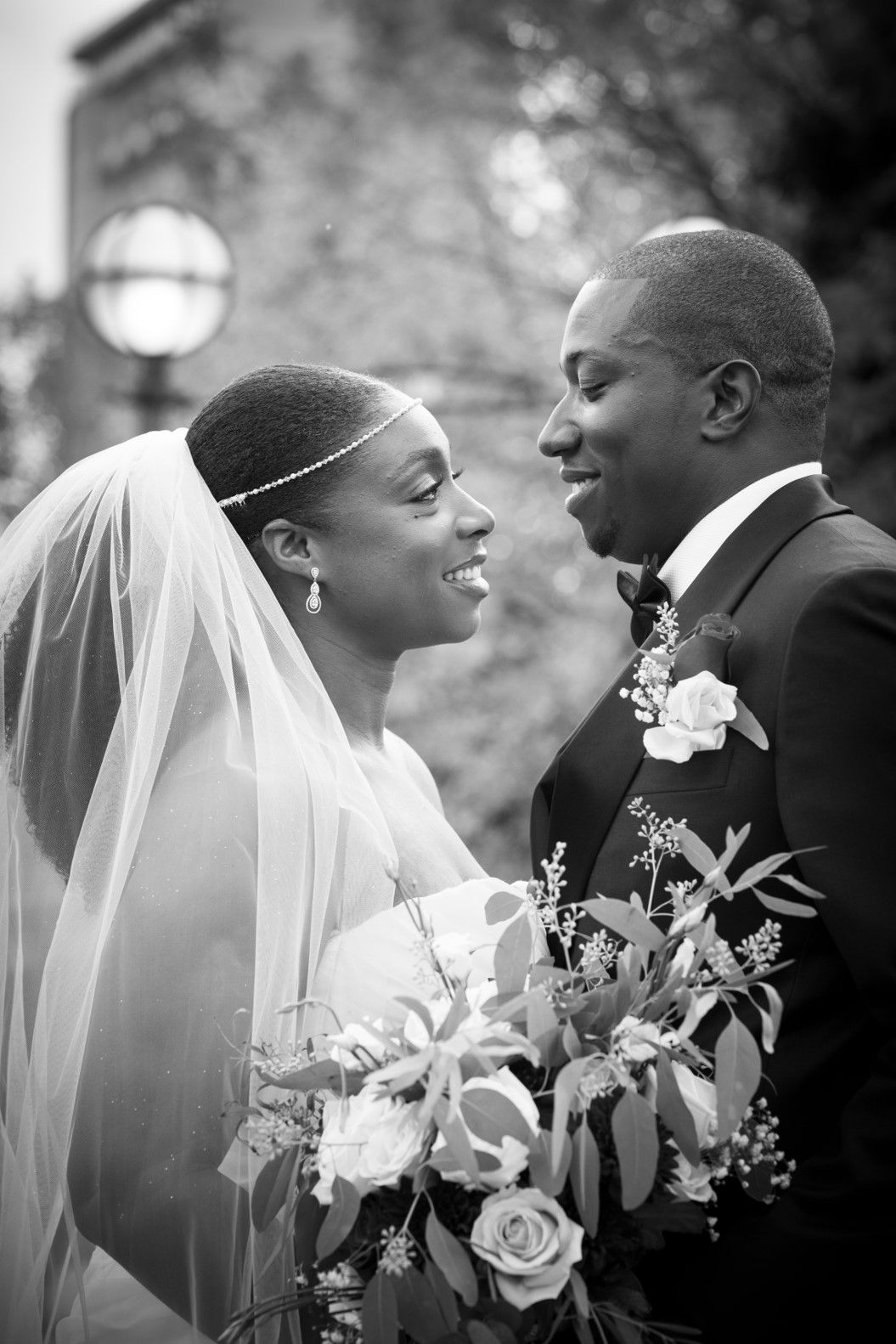 black bride and groom looking into each others eyes