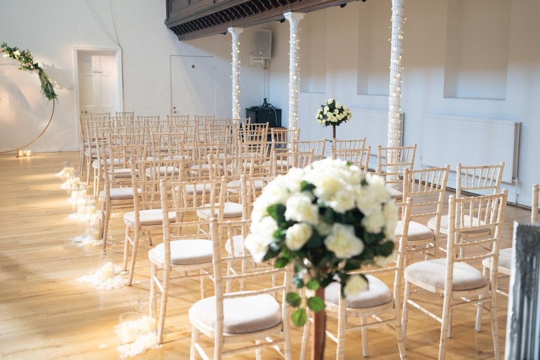 wedding ceremony styling cream flower pew ends