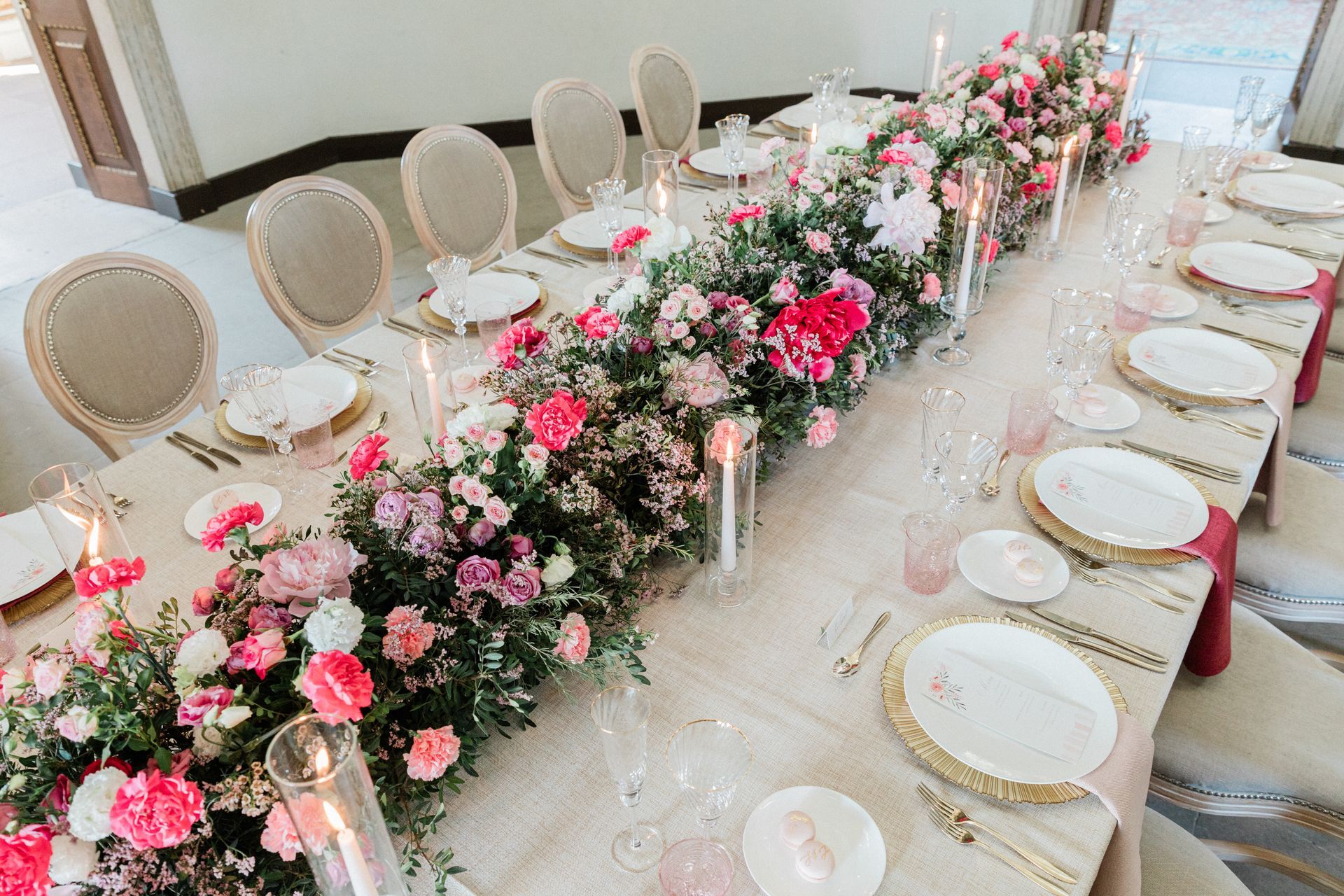 Sophisticated London wedding reception design with coordinated candles and high impact floral arrangements