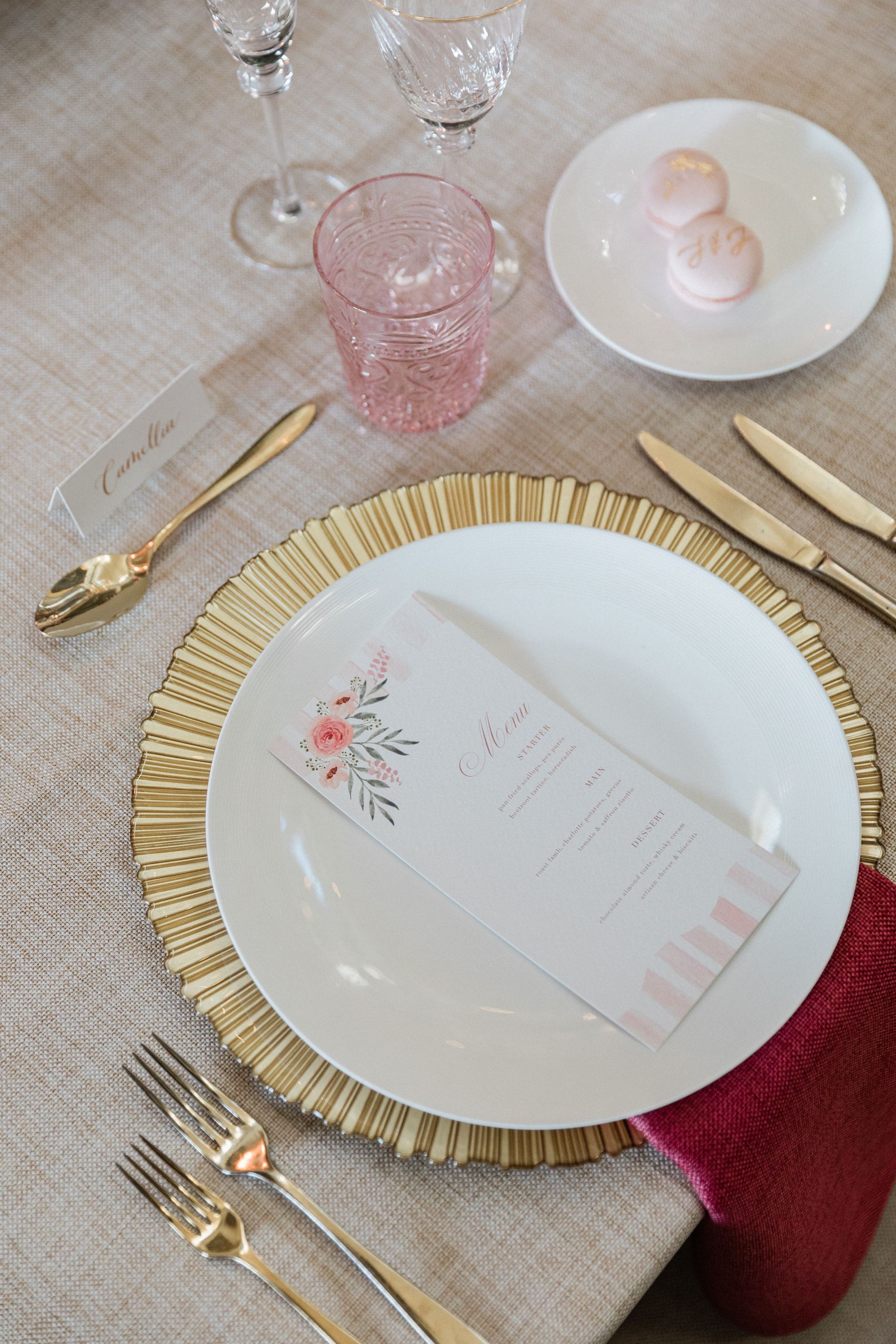 Elegant wedding stationery menu on gold charge plate at colourful London wedding planned by Pearline Events at Chiswick House