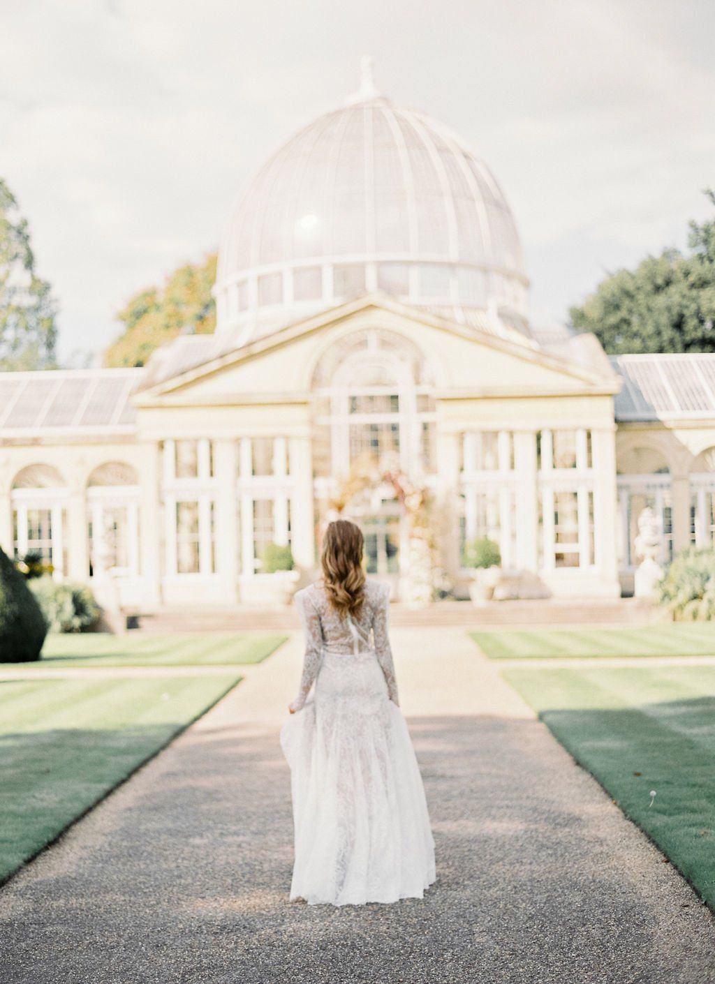 Dry hire venue bride standing outside facing Syon Park