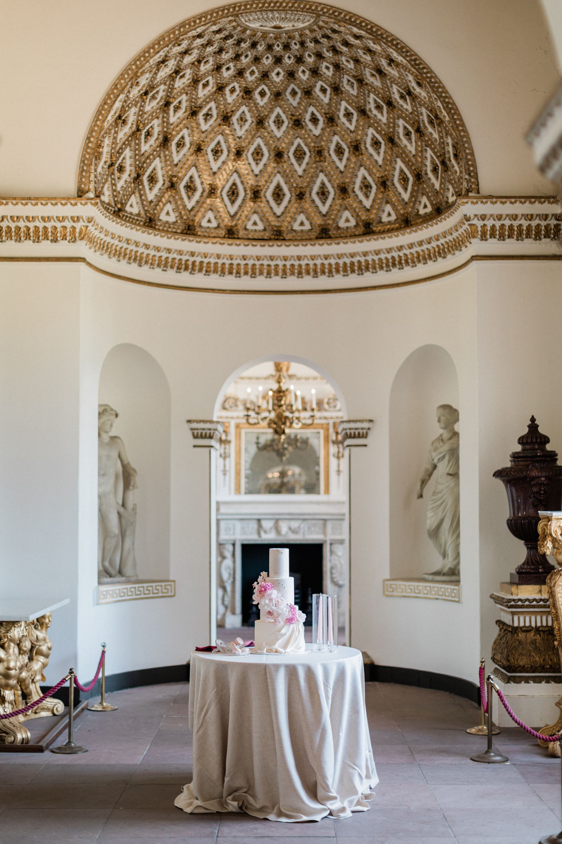 Colourful 3-tier wedding cake with 3 tiers and pink wafer flowers planned by Pearline Events at Chiswick House