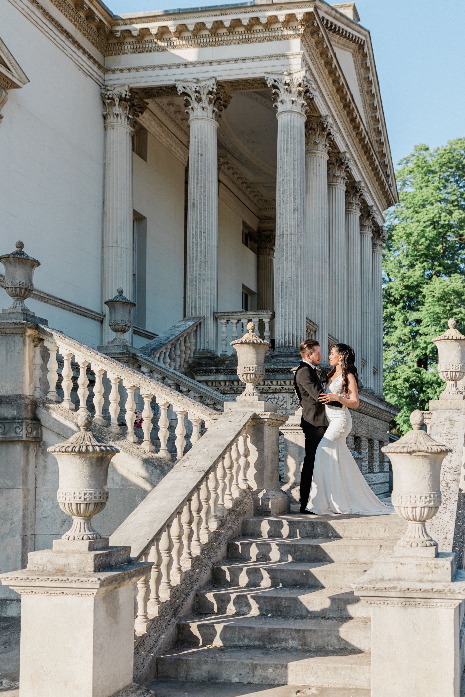 Bride and groom looking at each other outside Chiswick House at Elegant London wedding planned by Pearline Events