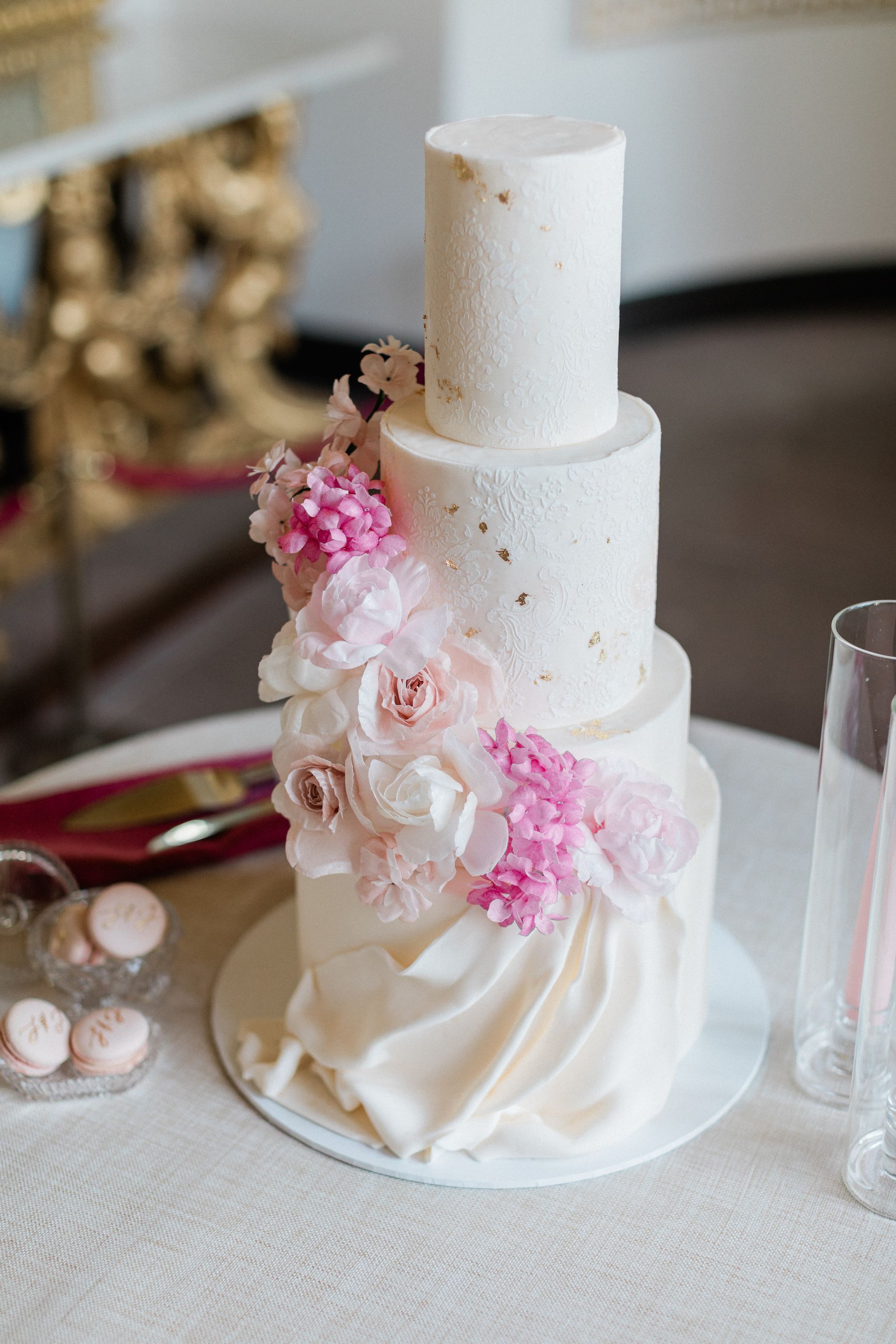 Colourful wedding cake close up of pink and white wafer flowers planned by Pearline Events at Chiswick House