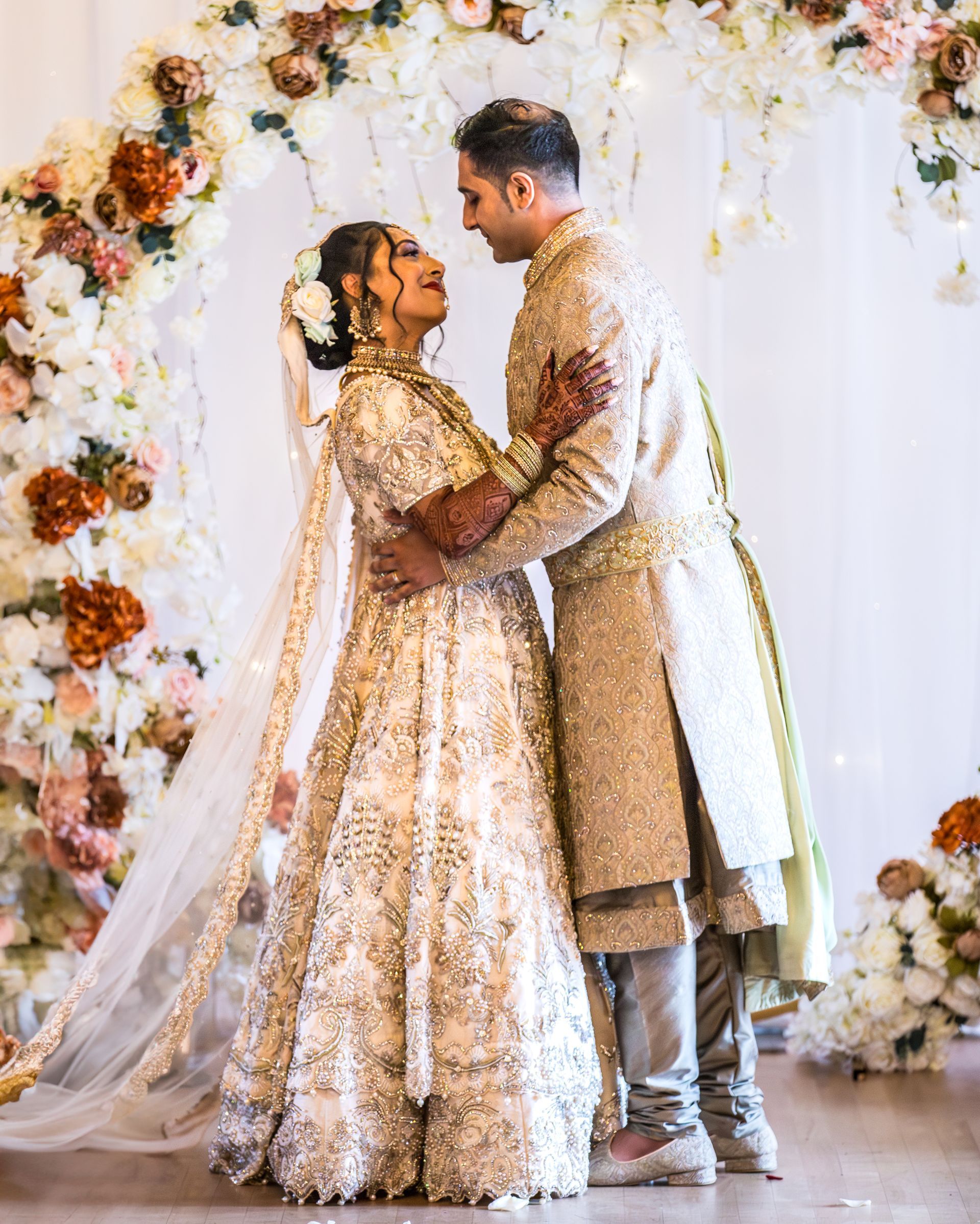Asian wedding couple embracing planned by pearline events Forty Hall London
