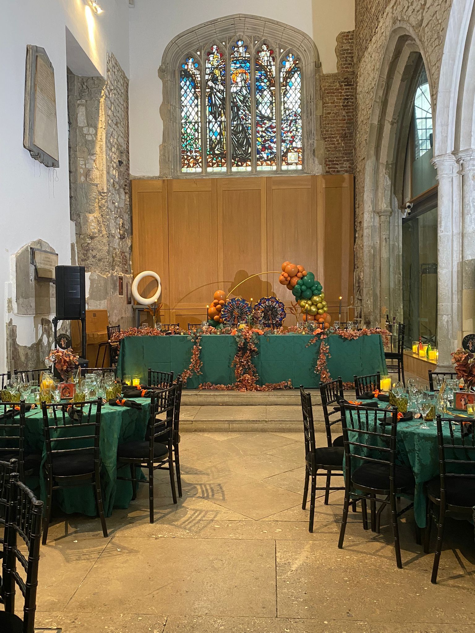 Colourful london wedding reception orange green black table decor