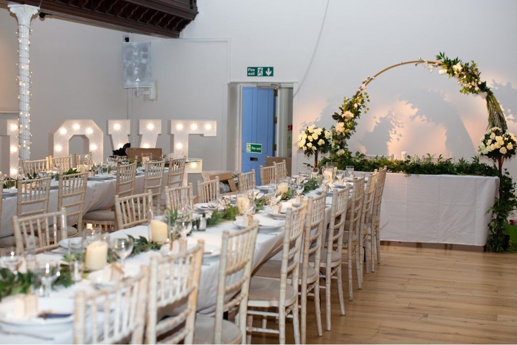 wedding reception long table set up with arch